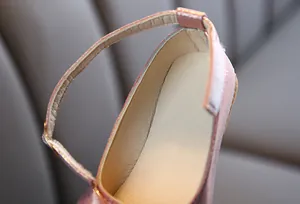 Close-up of pink glitter Mary Jane shoes for girls with buckle strap and soft lining