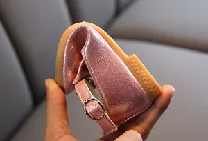 Detail of pink glitter Mary Jane shoes showing the flexible non-slip rubber sole