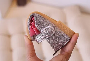 Detailed view demonstrating the flexible non-slip rubber sole of the pink sequin girl shoes