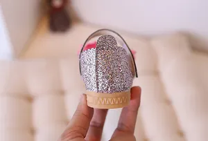 Close-up of pink glitter girl's princess shoe with reinforced heel and non-slip sole