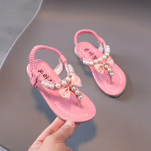Sandalias rosas para niñas con perlas, lazo de satén y correa elástica trasera