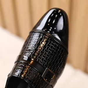 Elegant boys black leather dress shoes with glossy patent toe and woven texture finish