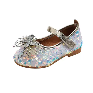 Detail of glitter sequins and rhinestone bowknot on girls' Mary Jane princess shoes