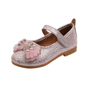 Pink glitter Mary Jane shoes for girls with sequin texture and decorative bow detail