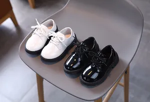 Classic black and white patent leather lace-up oxford shoes for boys with rubber soles