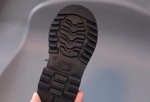 Detailed view of non-slip rubber sole with durable grip texture for boys formal shoes