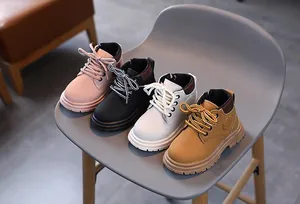Classic pink, black, beige, and khaki kids' work boots with durable non-slip soles