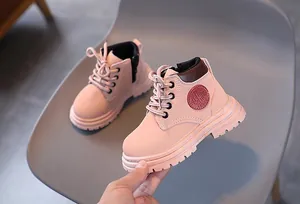 Detail of pink children's martin boots with side zipper and durable anti-slip rubber sole