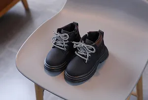 Classic black kids Martin boots with thick anti-slip rubber soles and retro leather finish