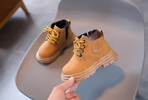 Detail of khaki kids martin boots with laces and side zipper for easy wear
