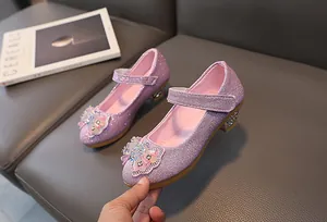 Detail of purple sequin Mary Jane girls shoes with rhinestone bow and low block heel