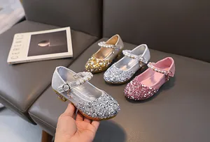 Detailed view of sparkly Mary Jane shoes with pearls in silver, gold, and pink colors