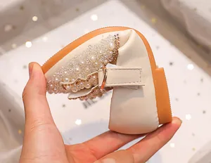 Detail of flexible rubber sole on girls' princess flat with pearls and rhinestones