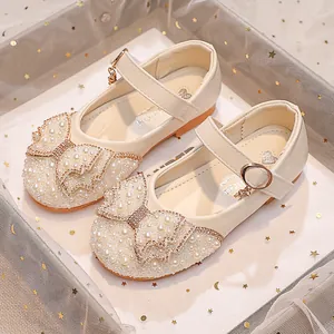 Sparkly white girls princess shoes with faux pearls and rhinestone bow on Mary Jane strap
