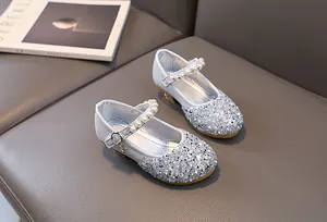Detailed view of girls silver glitter princess shoes with pearl straps and small heels