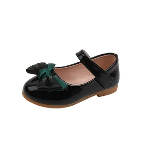 Girl's black patent leather Mary Jane shoes with double bow detail and flat rubber sole