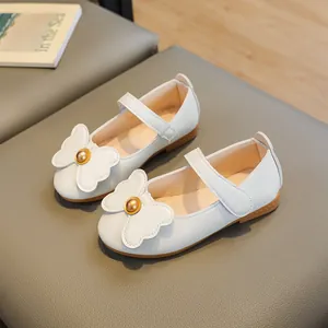 White faux leather Mary Jane shoes for girls featuring cute bow and non-slip sole