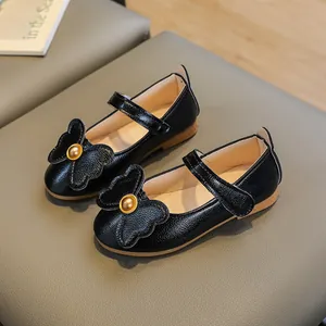 Classic black girls' Mary Jane shoes with soft bow detail and durable flat rubber sole