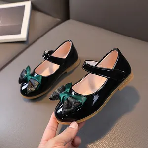 Classic girls black patent leather Mary Jane shoes with green bow and non-slip rubber sole