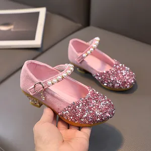 Sparkly pink girls' Mary Jane dress shoes with sequins, pearls, and low chunky heels