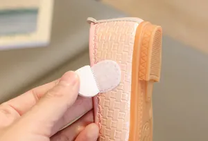 Detailed macro view of pink girls princess shoe showing woven texture and velcro closure