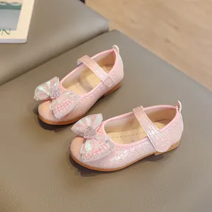 Pink glitter princess shoes for girls with iridescent bow and heart rhinestone detail