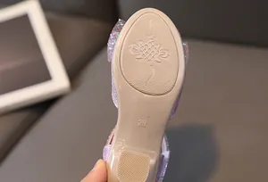 Close-up of beige non-slip rubber sole with floral pattern and size 28 detail