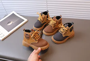Detail of colorful kids ankle boots showing side pocket and thick anti-slip rubber soles