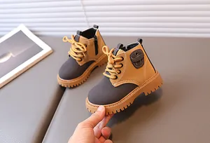 Detail of children's boots with thickened non-slip soles and side zipper design