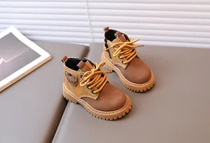 Detail view of boys' vintage boots featuring side zippers and non-slip rubber soles