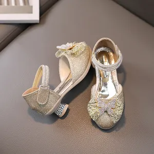 Sparkly gold girls princess shoes with rhinestone bows and chunky heels for parties
