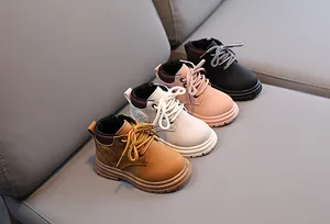 Detail view of children's martin boots in four colors with side zipper and rubber sole
