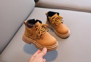 Detail of camel kids martin boots with side zipper and durable anti-slip rubber sole