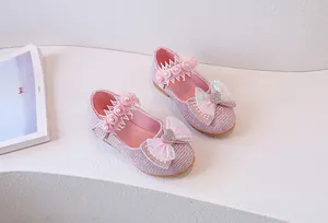 Detail of pink girls princess shoes with sequins, lace, pearls and heart crystal