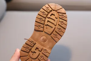 Detail of durable rubber sole with deep anti-slip traction pattern for toddler boots