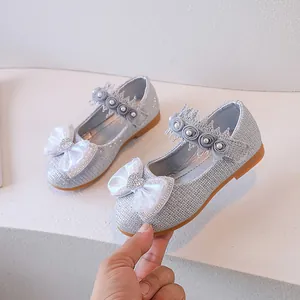Sparkly silver girls princess shoes with large white bow and pearl lace detail