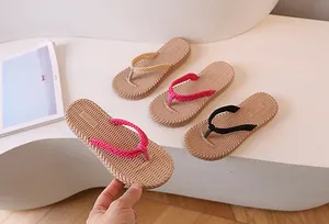 Flat lay of woven strap flip flops in black, beige, rose red and pink colors