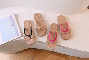Close-up of woven flip-flops with soft non-slip soles in four vibrant summer colors
