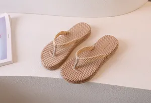 Detail showing woven texture straps and soft sole of beige women's flip flops