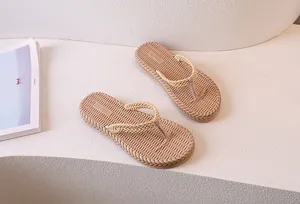 Detail of women flip-flops with braided straps and anti-slip woven texture soles