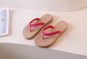Macro shot of rose pink woven straps and non-slip sole texture on summer flip-flops