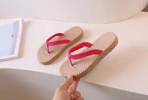 Close-up of children's pink woven straps and anti-slip textured sole on flip flops