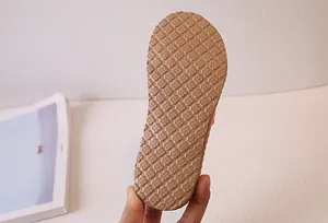 Close-up of brown anti-slip sole with grid texture for lightweight beach sandals