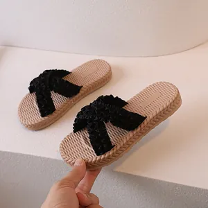 Women's classic beige and black slide sandals with woven sole and pleated fabric straps