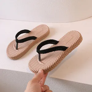 Kids casual flip flops with khaki non-slip sole and black woven straps for summer beach