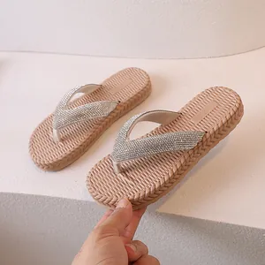 Women's flip flops with rhinestone straps and woven texture sole for beach wear