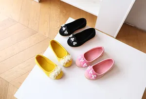 Flat ballet shoes for girls featuring suede flowers with pearl centers in three colors