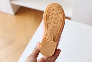 Pink girl's flat shoe featuring a durable honeycomb anti-slip rubber sole in size 26