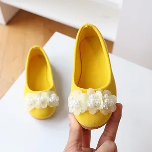 Yellow suede girls princess flats with delicate white flowers and pearl accents