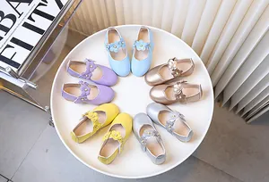 Top view of girls' Mary Jane shoes in five candy colors with floral velcro straps